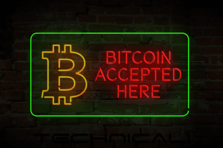 Bitcoin Accepted Here written in glow as a glow board outside merchant show