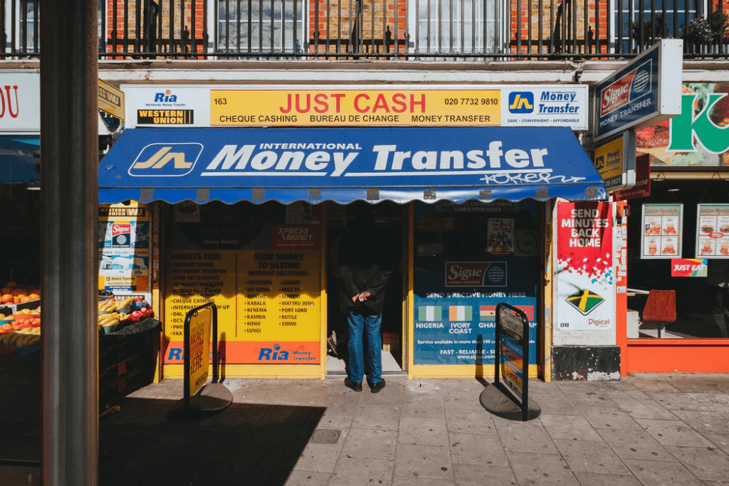 man standing at Money transfer shop