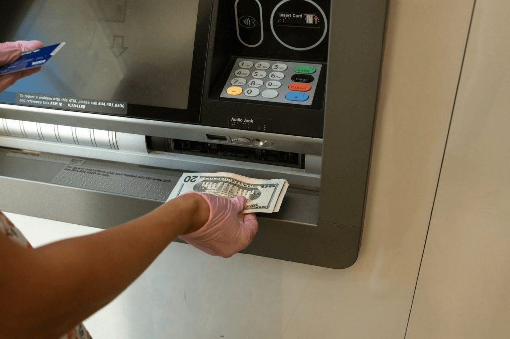 withdrawal of dollars from ATM machine