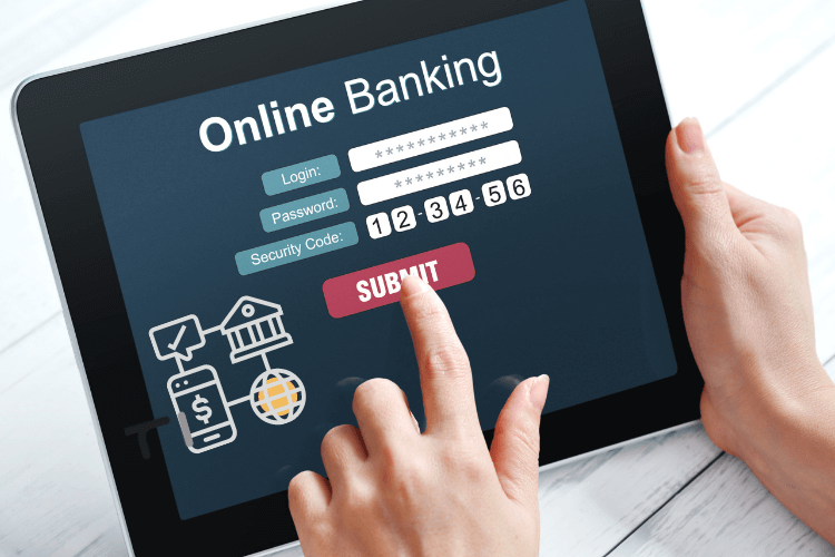 Online banking being done on a tablet , finger placed on submit button