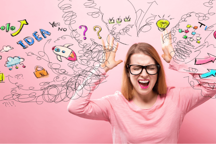 woman shown in pink, is getting stressed with ideas, information overload & decisions to make. 