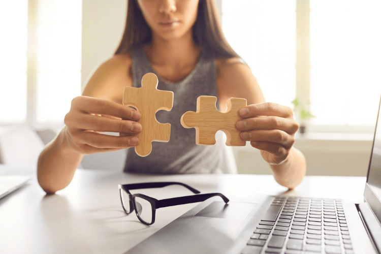 woman integrating two wooden pieces