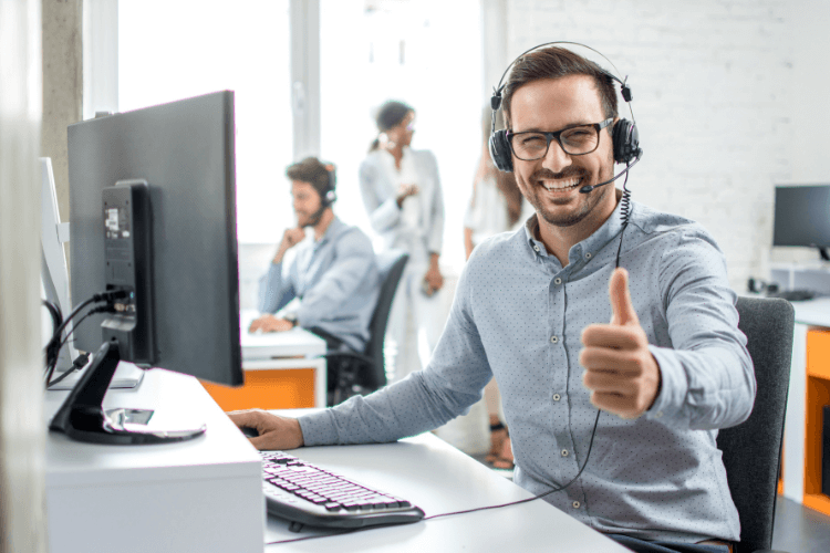 customer support executive showing thumbs up