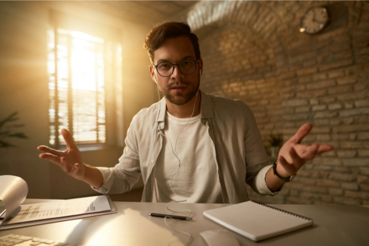 a guy with questioning and confused face with his both hands in air on sides, giving questioning look