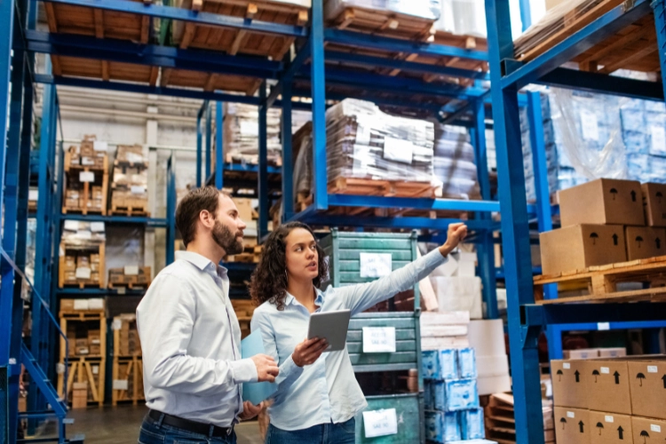 two workers analyzing the inventory