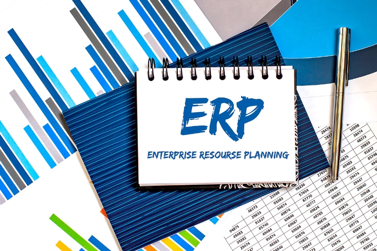 Enterprise Resource Planning on notepad with a pen