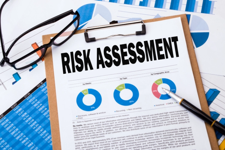 Risk assessment sheet with glasses and a pen