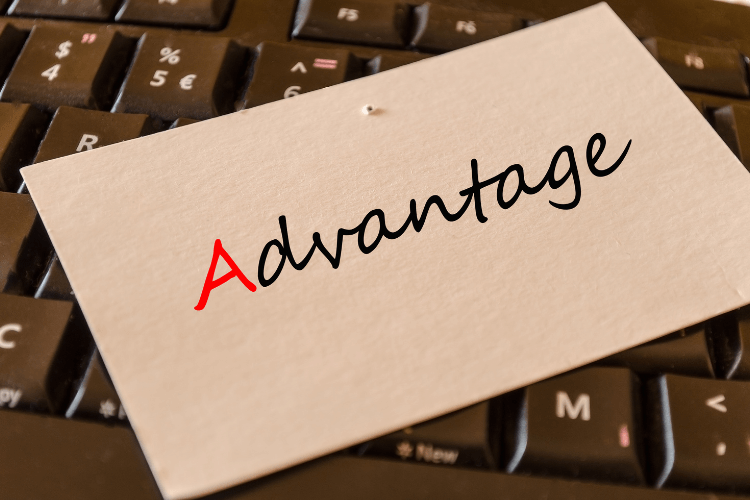 Card with the word "Advantage" bold and red "A" rests on a black keyboard.
