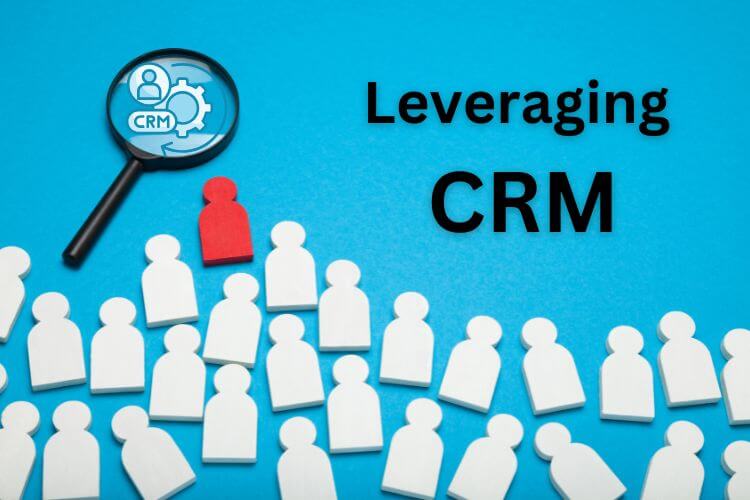 Illustration of white figures with one red standout under a magnifying glass labeled CRM, symbolizing customer relationship management.