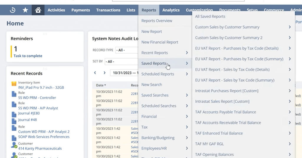 Dashboard interface with menu open showing options under "Reports," highlighting "Saved Reports.